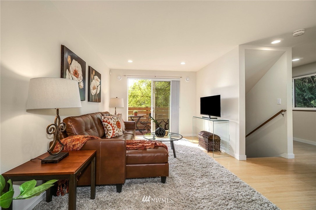 5409 26th Avenue Southwest, Unit B Seattle, WA 98106 - Photo 5 of 31 a living room with furniture and a flat screen tv
