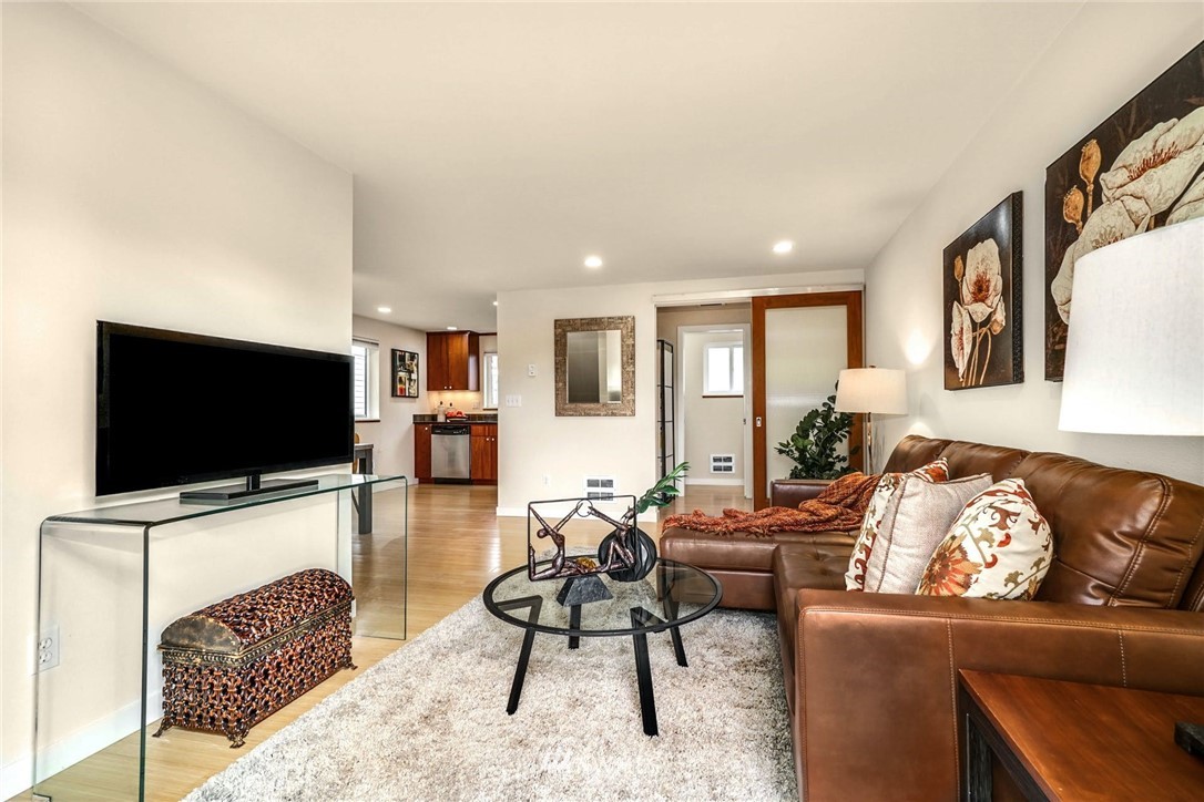 5409 26th Avenue Southwest, Unit B Seattle, WA 98106 - Photo 6 of 31 a living room with furniture and a flat screen tv