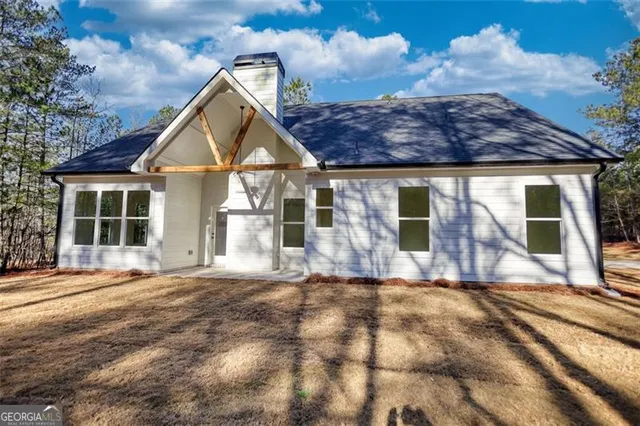 a view of swimming pool with an outdoor space and seating area
