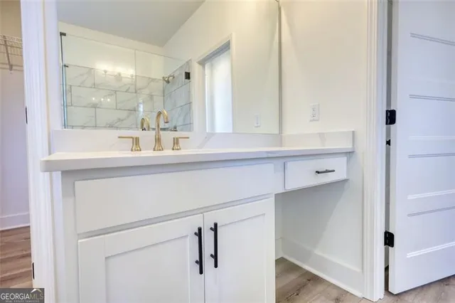 a view of a backyard with plants and large trees