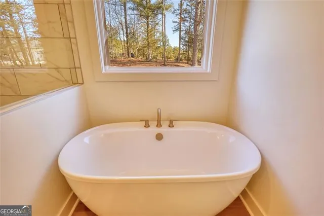 a view of balcony with wooden floor and fence