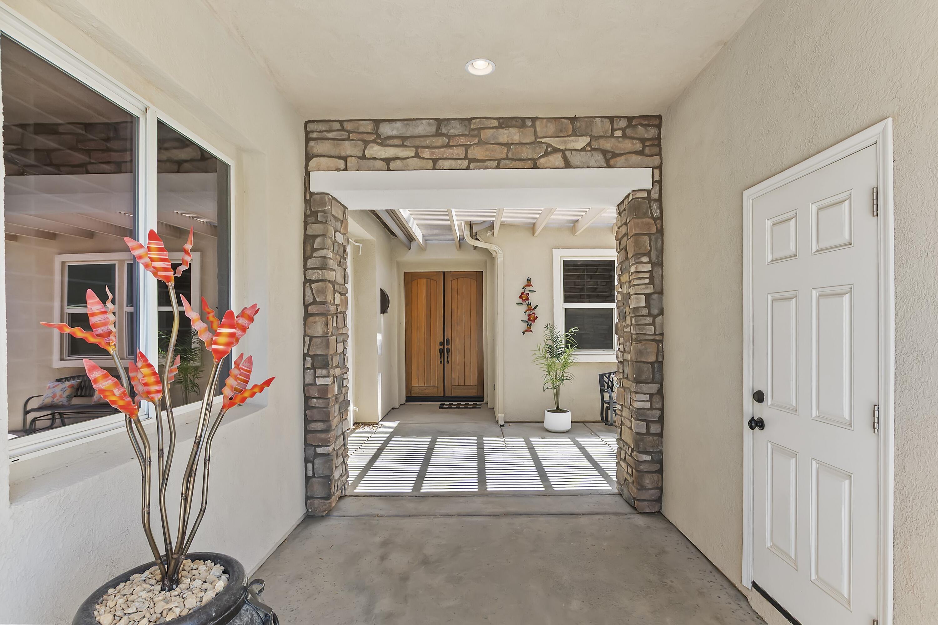 49714 Newman Circle Indio, CA 92201 - Photo 19 of 19 a view of entryway with a flower in a room