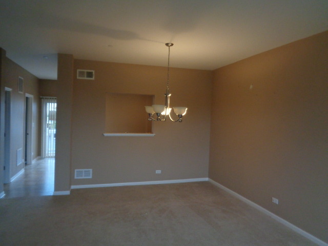10329 Kerry Ridge Court Chicago Ridge, IL 60415 - Photo 5 of 12 a view of a room with a hanging light