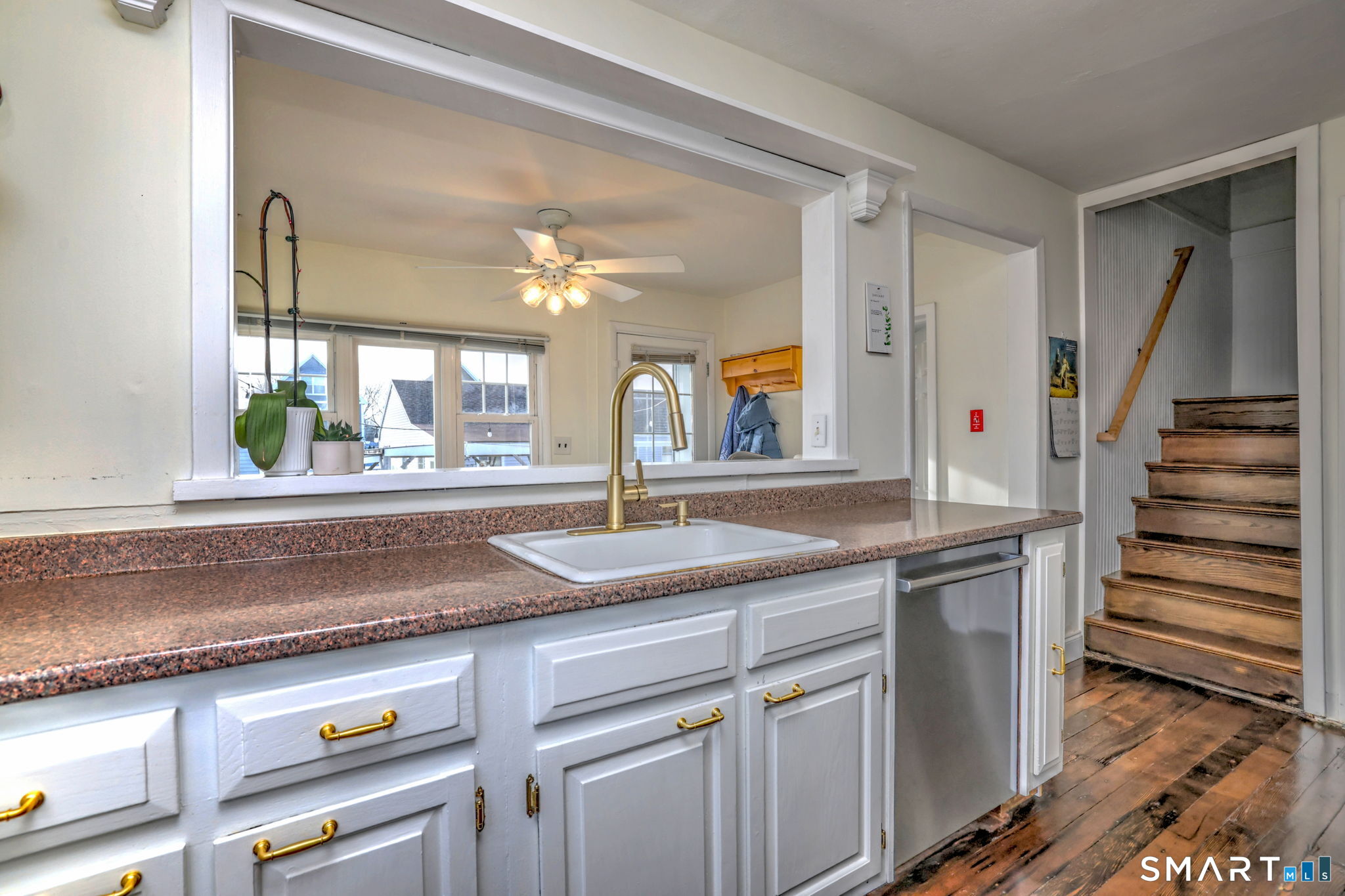 299 Meadows End Road Milford, CT 06460 - Photo 14 of 27 a kitchen with cabinets and window