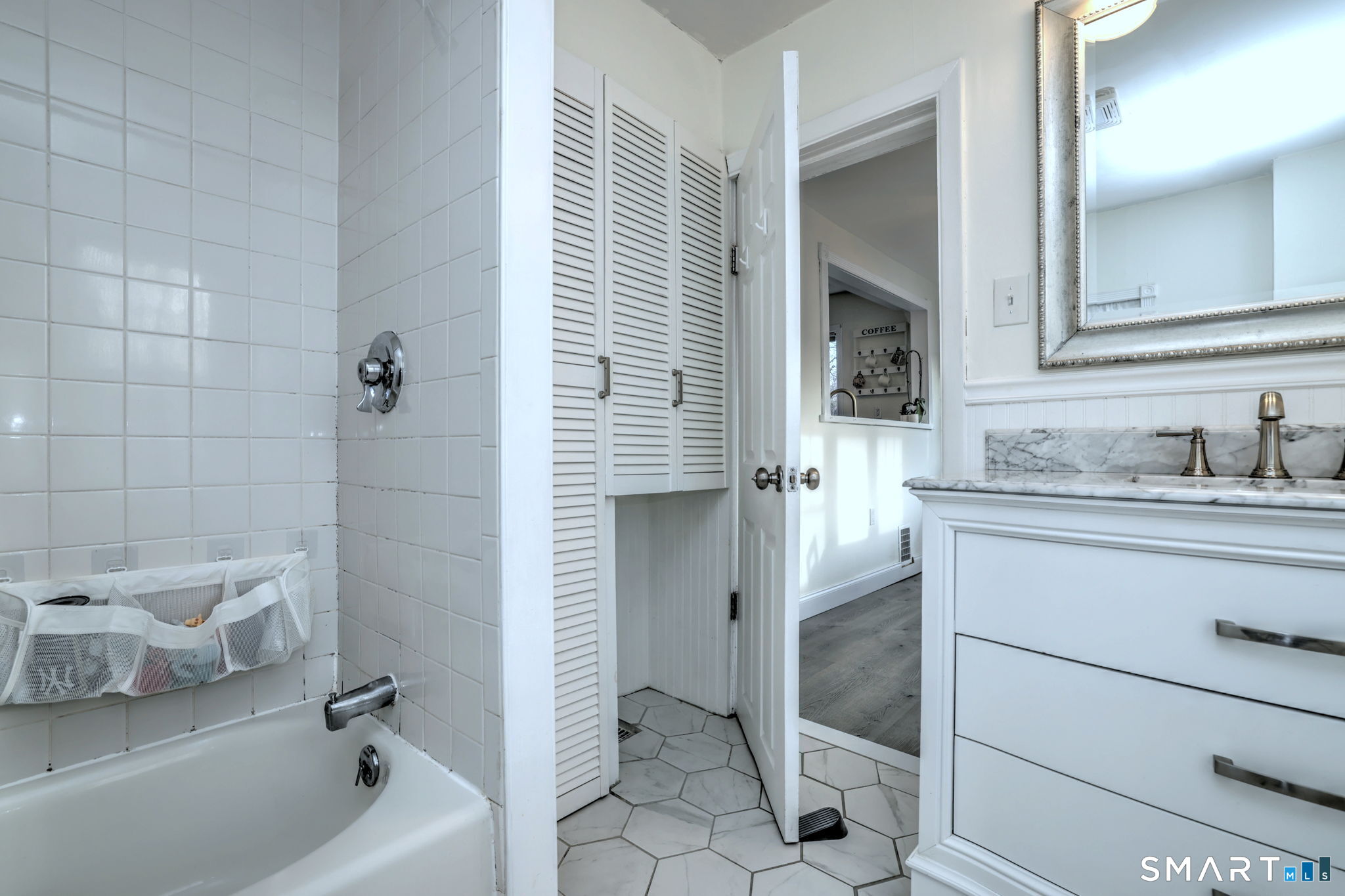 299 Meadows End Road Milford, CT 06460 - Photo 21 of 27 a bathroom with a sink a toilet and shower