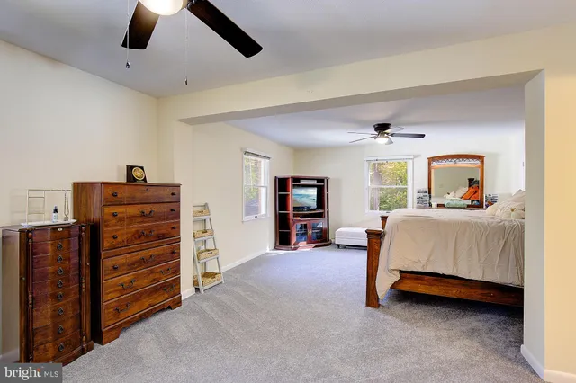 a bedroom with a bed and furniture