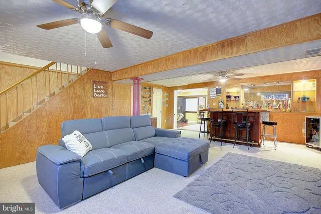 a view of a livingroom with furniture and front door