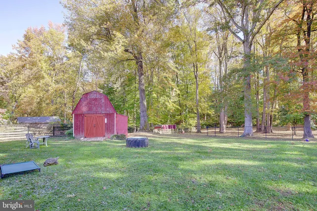 a view of a table and chairs in the garden