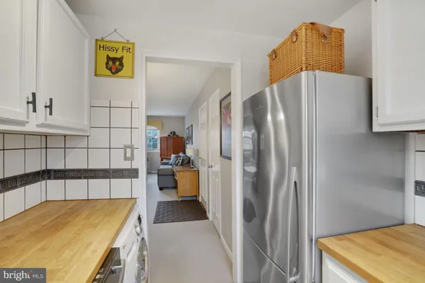 a utility room with sink dryer and washer