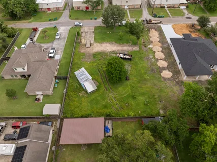an aerial view of a house with a garden