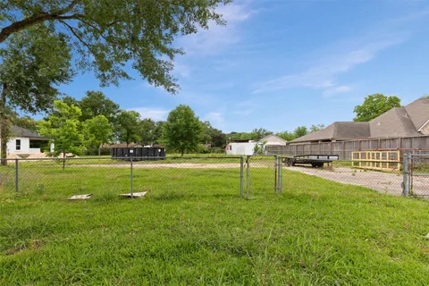 a view of a backyard with swimming pool