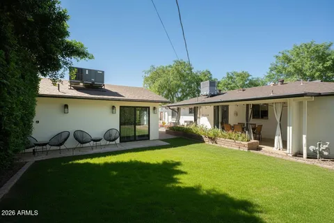 a front view of house with yard patio and green space