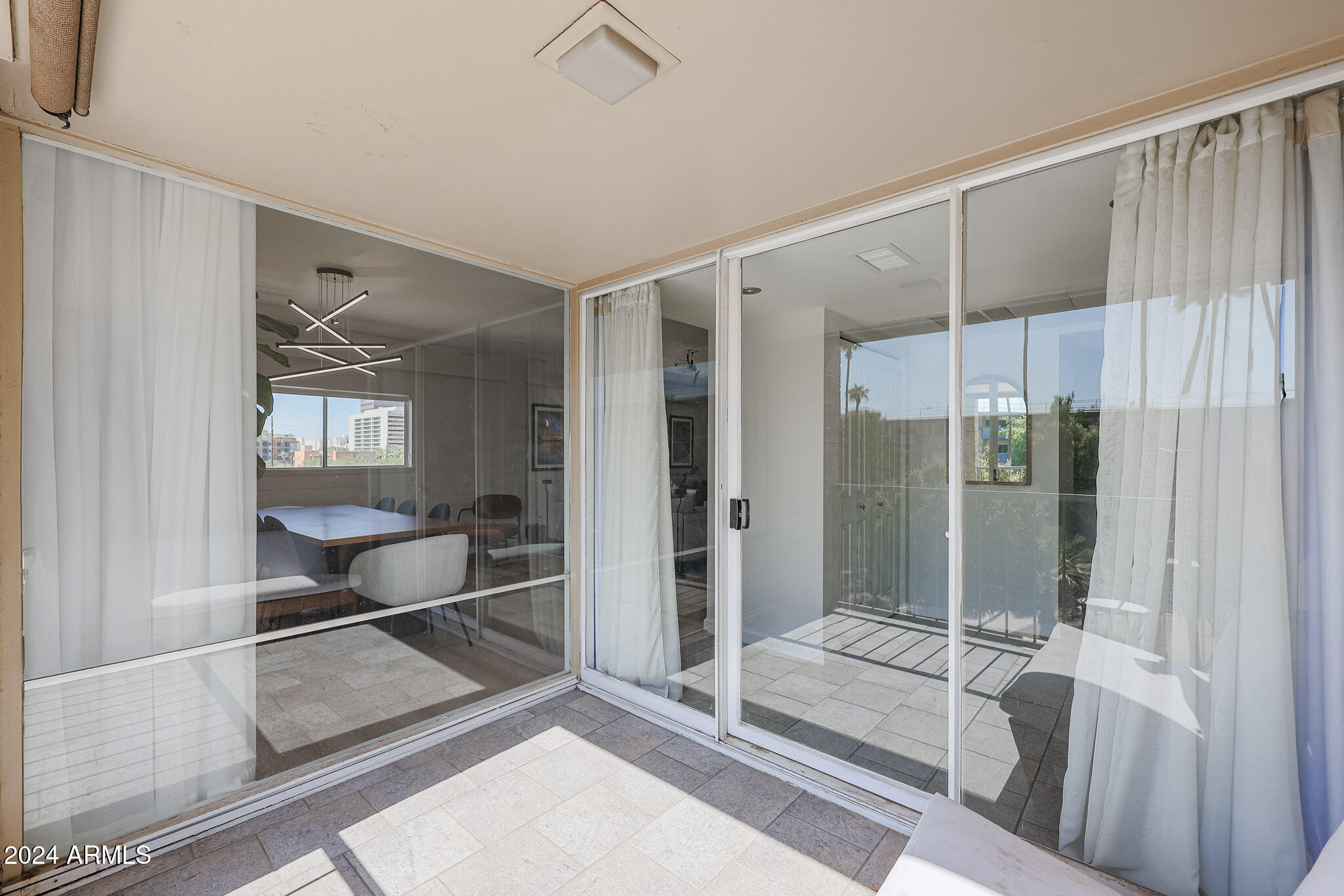 353 East Thomas Road, Unit C408 Phoenix, AZ 85012 - Photo 33 of 35 Dual doors to balcony