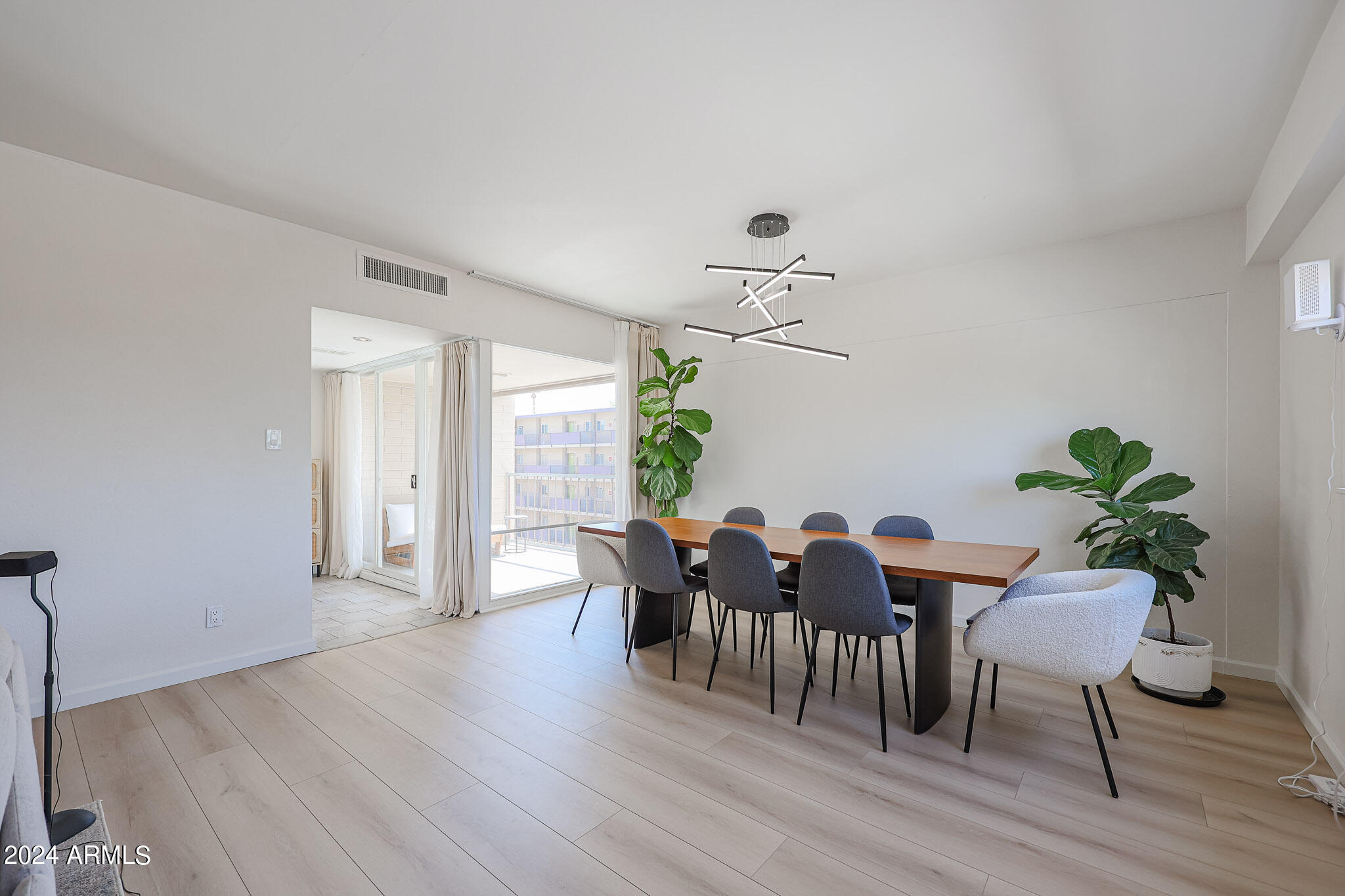 353 East Thomas Road, Unit C408 Phoenix, AZ 85012 - Photo 4 of 35 Dining with Doors to Balcony