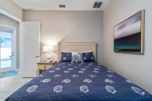 a bedroom with a bed and a view of bathroom