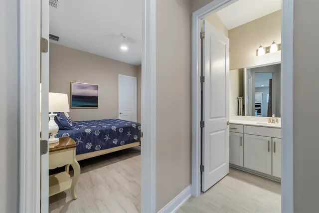 a bedroom with a large bed and a couch