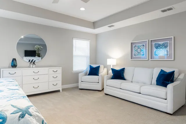 a bathroom with a double vanity sink a mirror and a bathtub