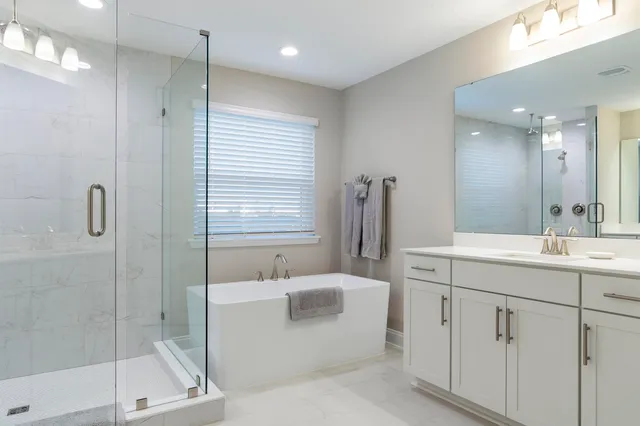 a bedroom with a large bed and a dresser