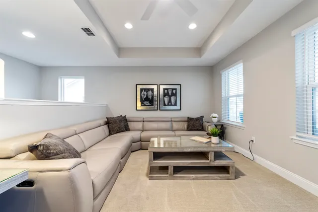 a view of a patio with lounge chairs