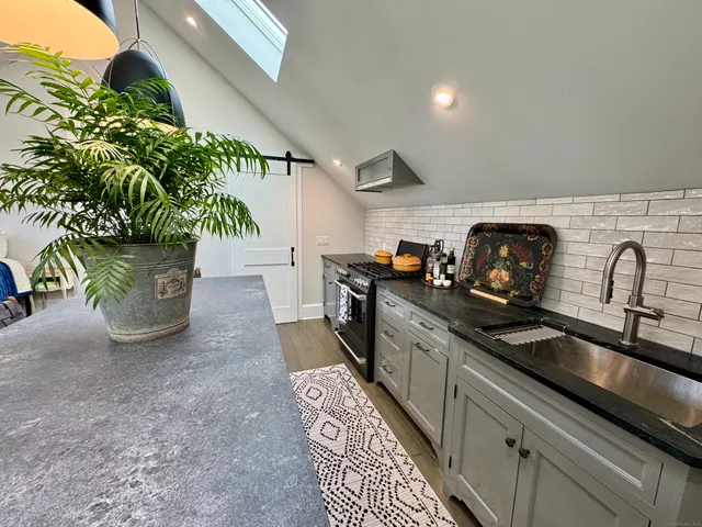 a kitchen with sink and stove