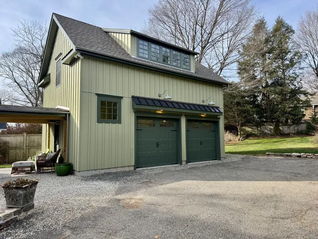a view of a house with a outdoor space and garage