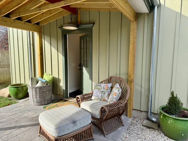 a balcony with furniture and wooden floor