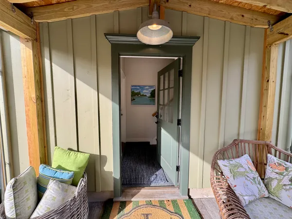 a view of a living room with furniture and a window