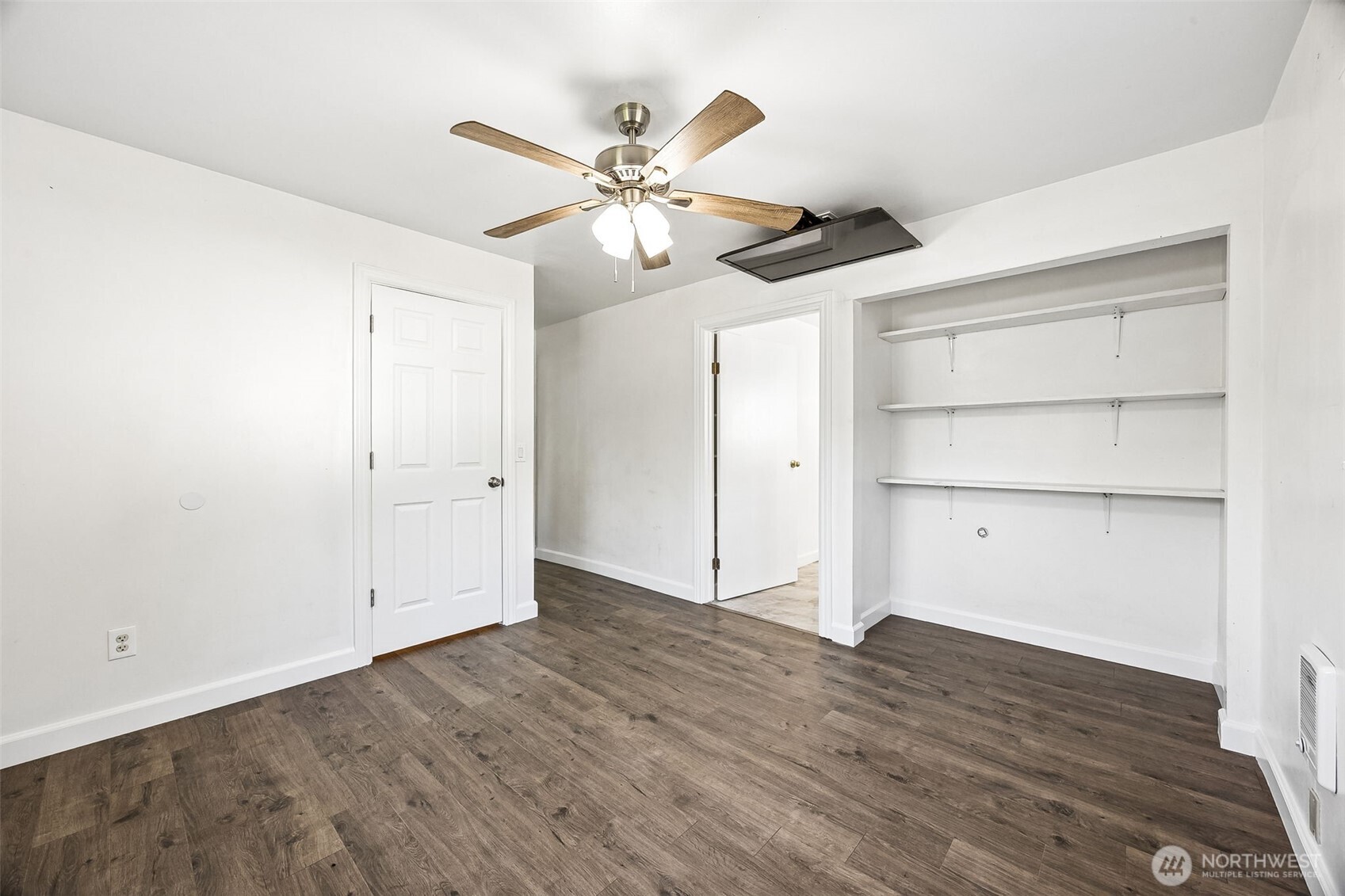 13710 Madrona Road Southwest Port Orchard, WA 98367 - Photo 21 of 40 a view of an empty room with wooden floor