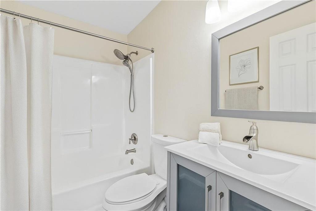 4230 Jonathan Lane Cumming, GA 30040 - Photo 34 of 57 a bathroom with a sink toilet and shower