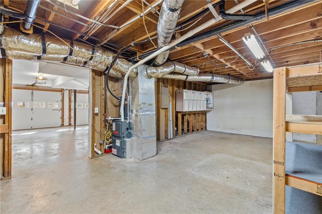 4230 Jonathan Lane Cumming, GA 30040 - Photo 40 of 57 a view of empty room with wooden ceiling