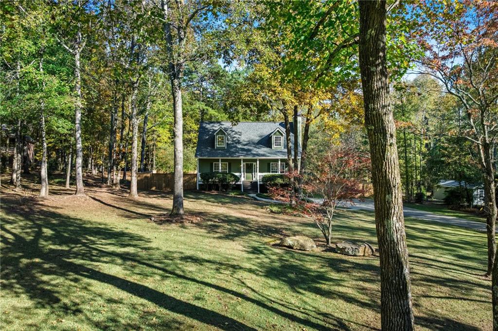 4230 Jonathan Lane Cumming, GA 30040 - Photo 4 of 57 a view of a house with backyard