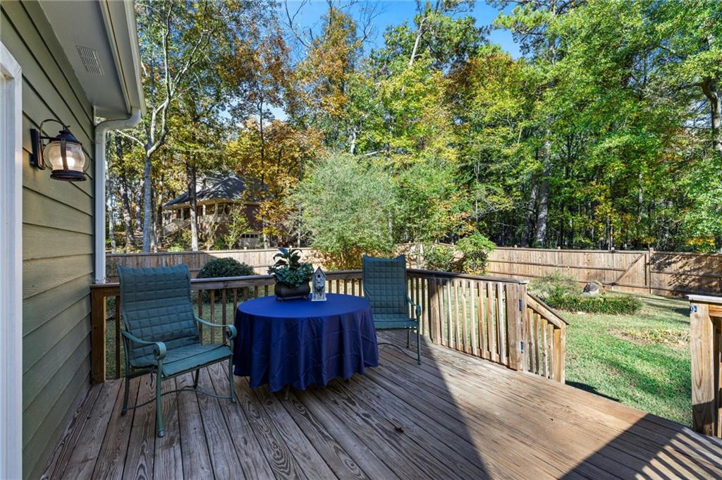 4230 Jonathan Lane Cumming, GA 30040 - Photo 42 of 57 a view of balcony with deck and outdoor seating