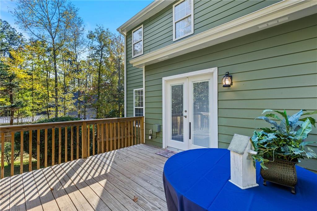 4230 Jonathan Lane Cumming, GA 30040 - Photo 43 of 57 a view of a deck with furniture