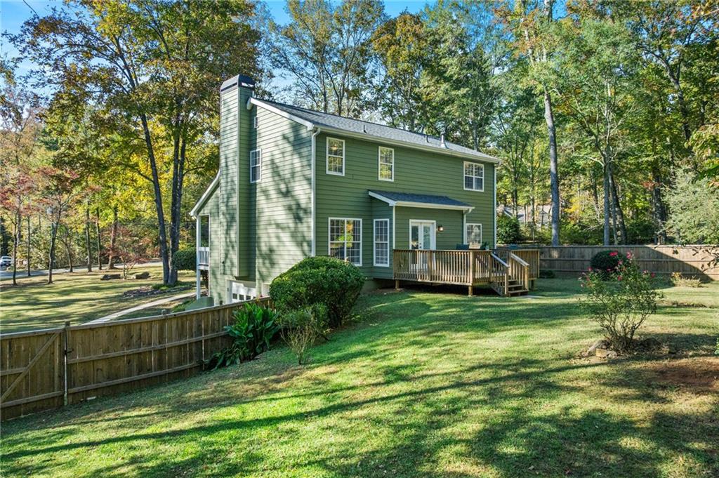 4230 Jonathan Lane Cumming, GA 30040 - Photo 47 of 57 a view of a house with backyard and sitting area