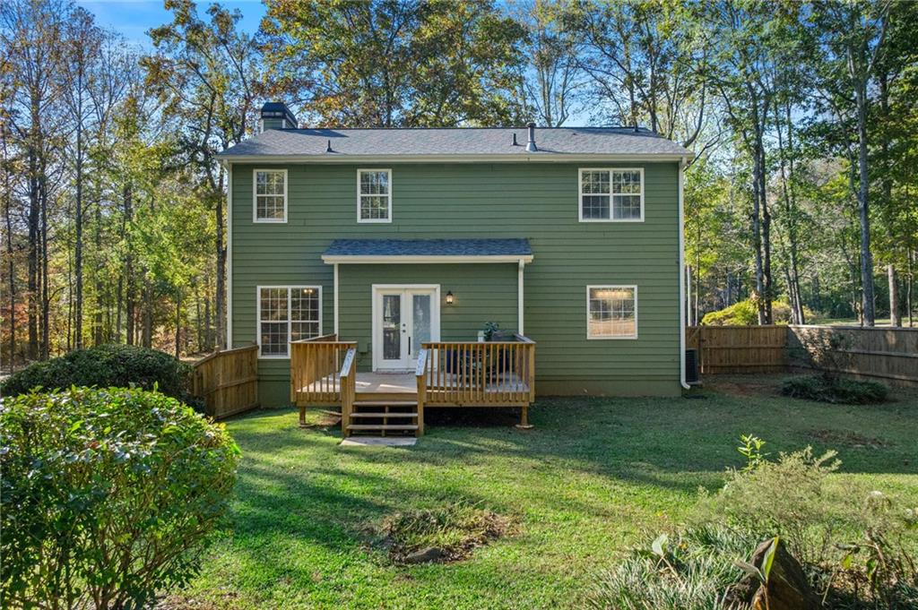 4230 Jonathan Lane Cumming, GA 30040 - Photo 48 of 57 a view of a house with a backyard