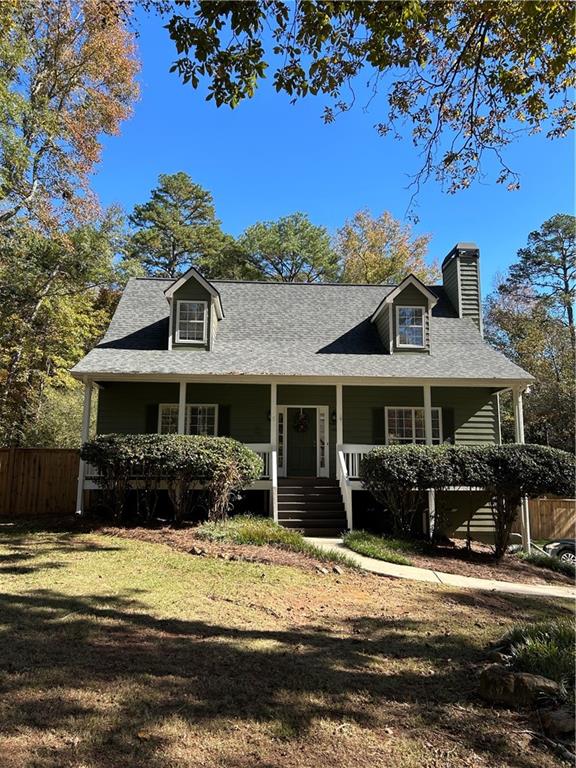 4230 Jonathan Lane Cumming, GA 30040 - Photo 57 of 57 a front view of a house with a porch