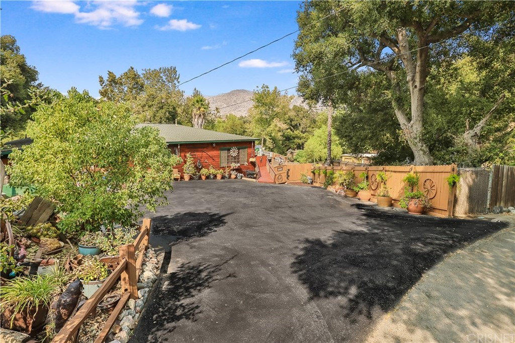 6621 Clear Springs Road Simi Valley, CA 93063 - Photo 1 of 1 a view of a street with some trees in the background