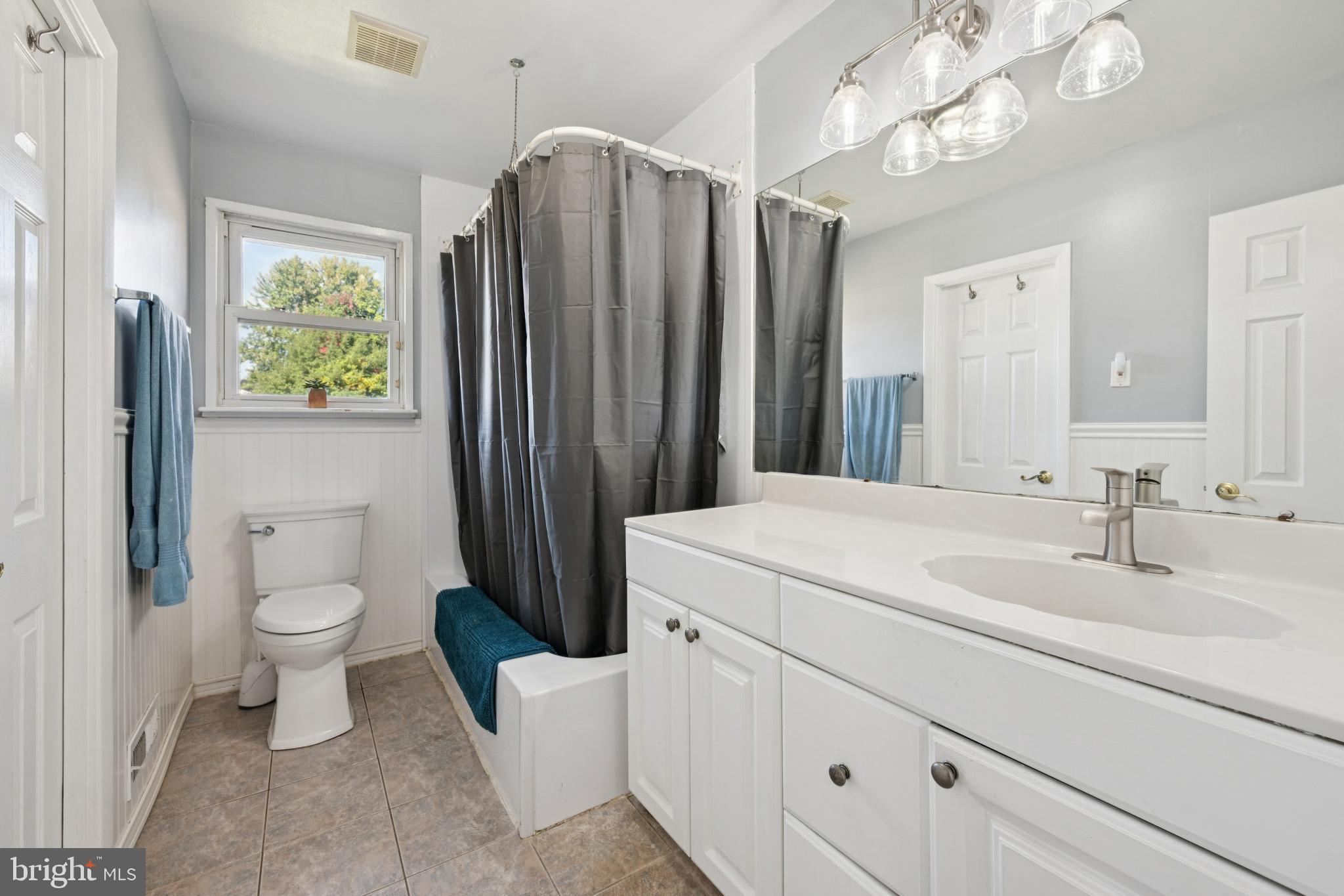 43 Princeton Drive Delran, NJ 08075 - Photo 16 of 25 a bathroom with a sink a toilet and a mirror