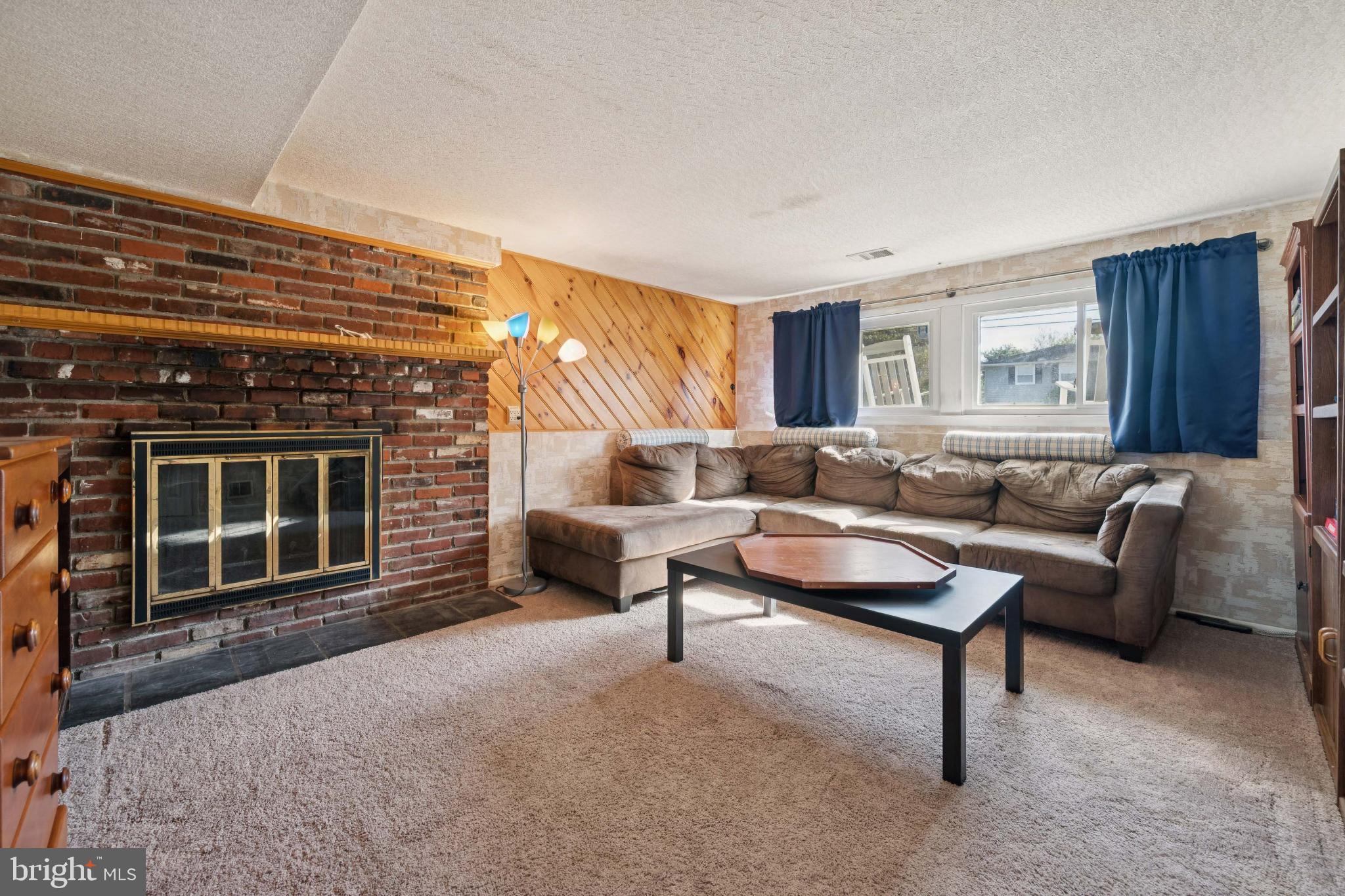 43 Princeton Drive Delran, NJ 08075 - Photo 18 of 25 a living room with furniture and a fireplace