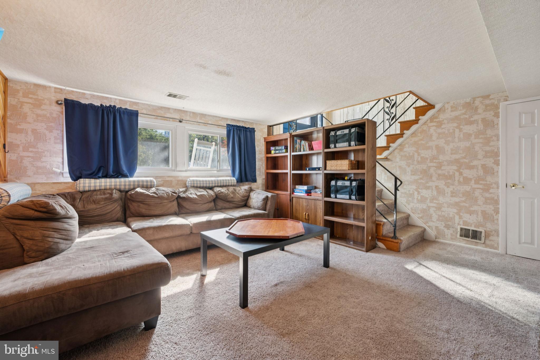 43 Princeton Drive Delran, NJ 08075 - Photo 19 of 25 a living room with furniture and a book shelf