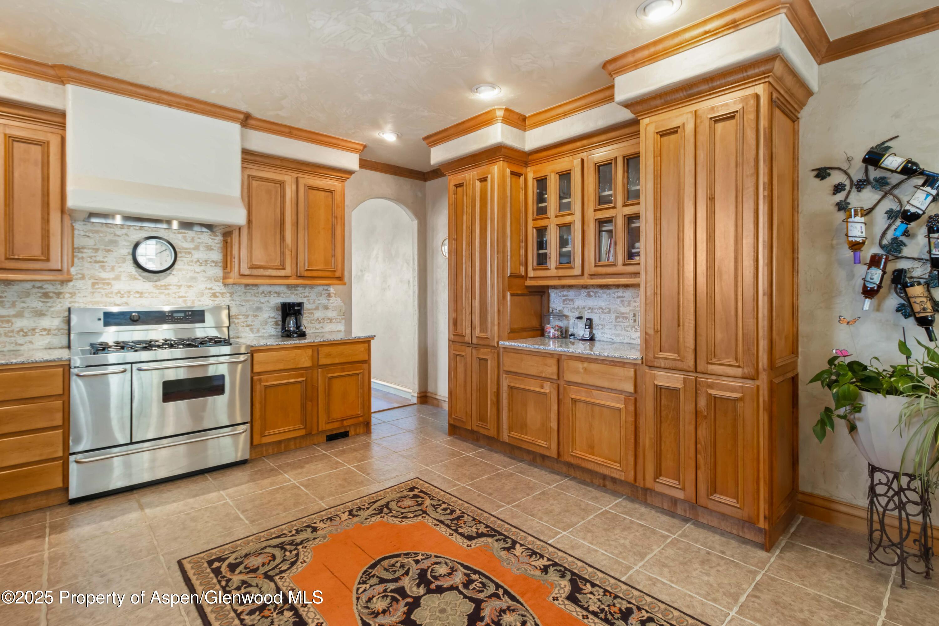 2687 Fairview Heights Court Rifle, CO 81650 - Photo 11 of 40 a kitchen with a stove a sink and a refrigerator
