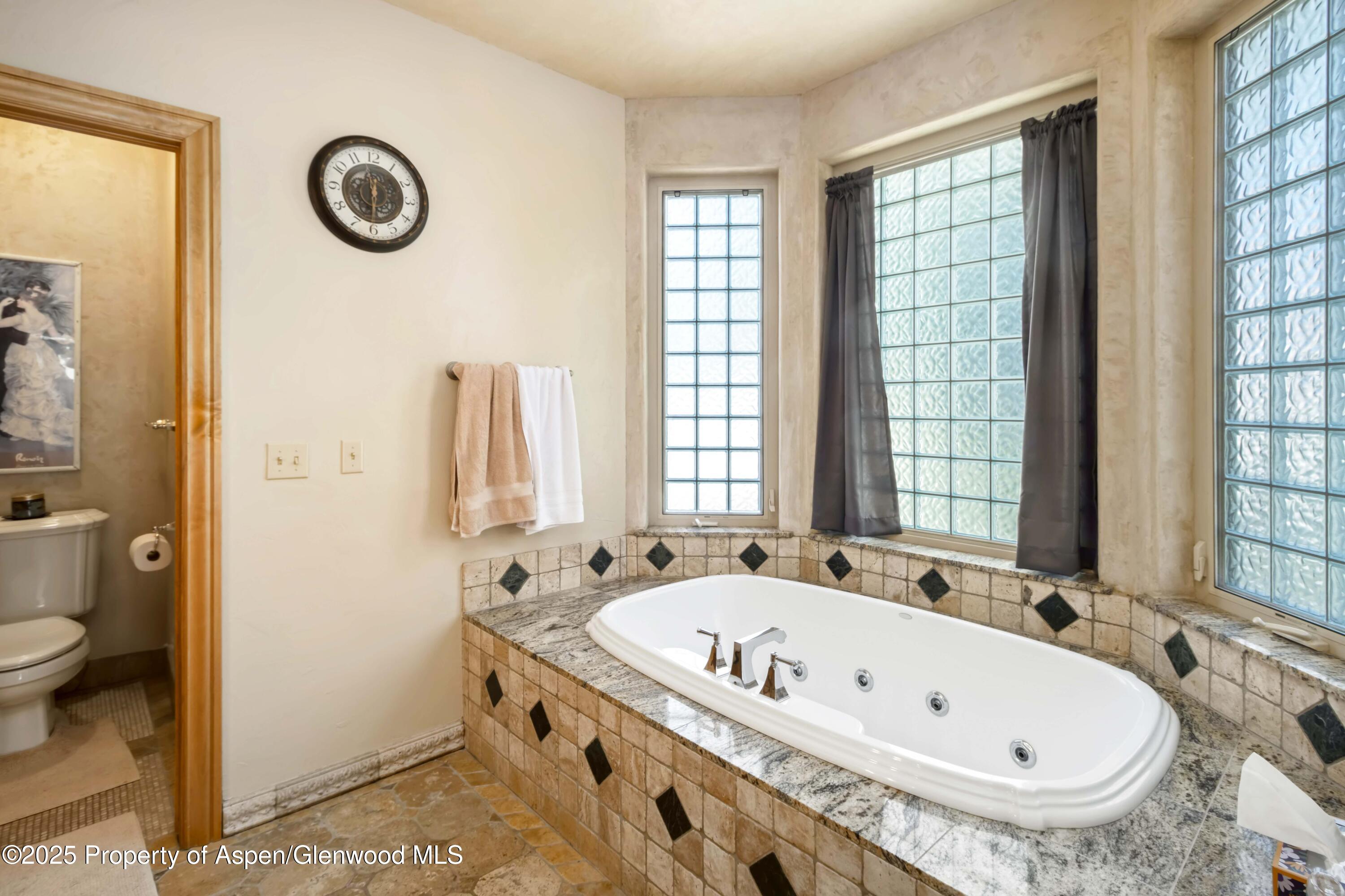 2687 Fairview Heights Court Rifle, CO 81650 - Photo 15 of 40 a bathroom with a tub and a sink