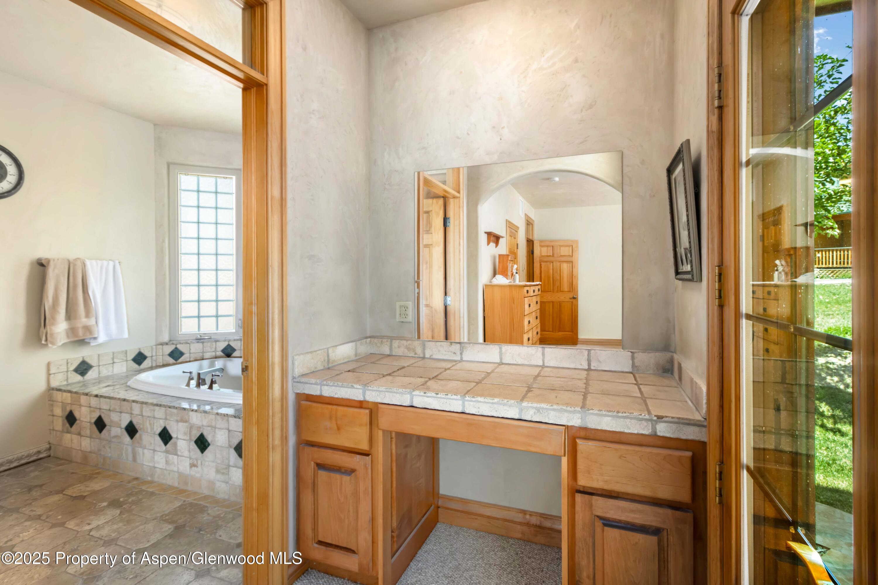 2687 Fairview Heights Court Rifle, CO 81650 - Photo 16 of 40 a bathroom with a sink and a mirror