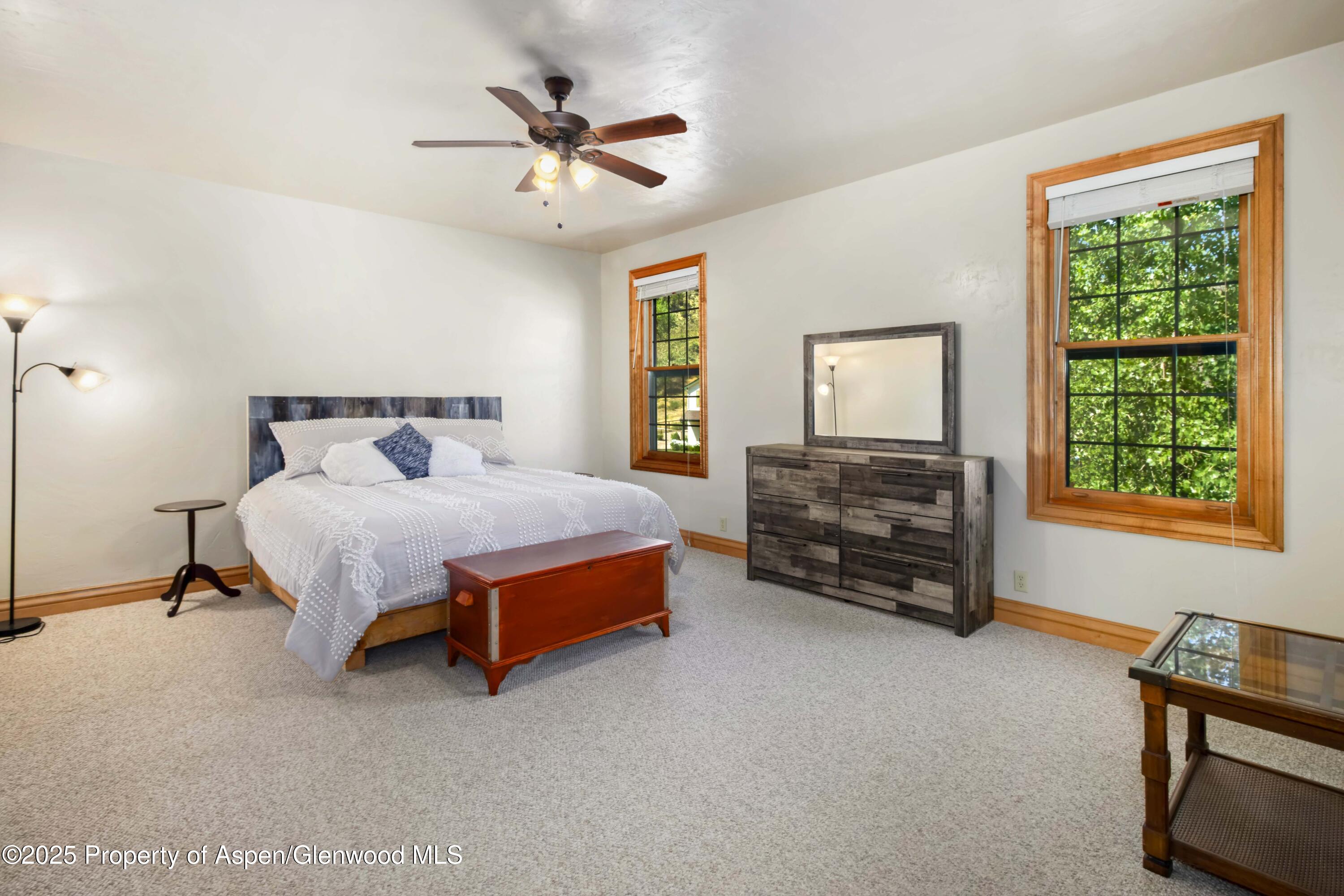 2687 Fairview Heights Court Rifle, CO 81650 - Photo 19 of 40 a bedroom with a bed dresser and a window