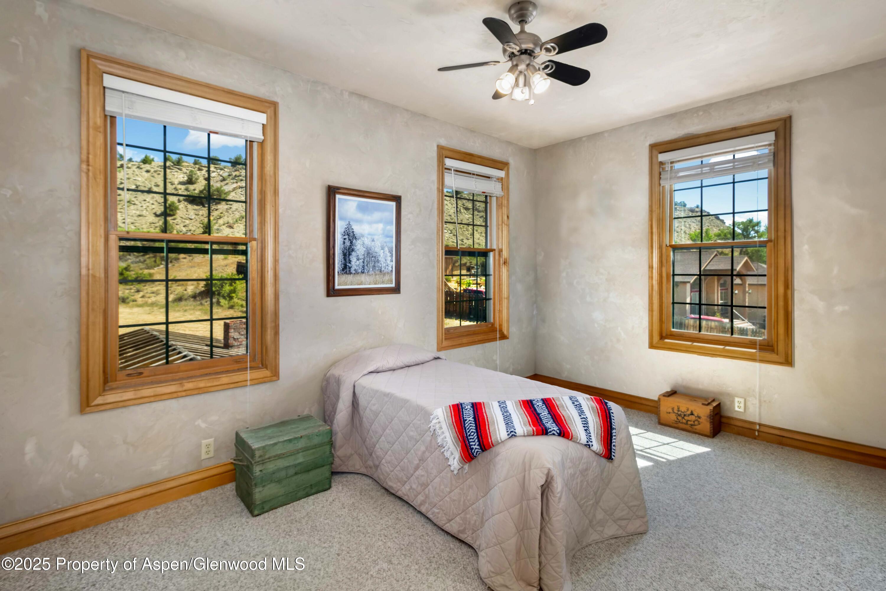 2687 Fairview Heights Court Rifle, CO 81650 - Photo 23 of 40 a bedroom with a bed and a window