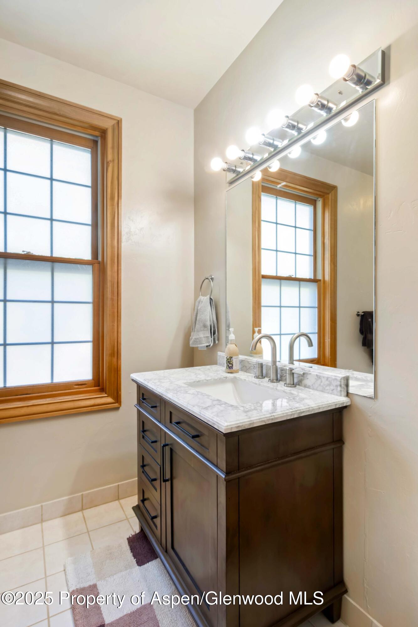 2687 Fairview Heights Court Rifle, CO 81650 - Photo 24 of 40 a room with a sink a window and chandelier