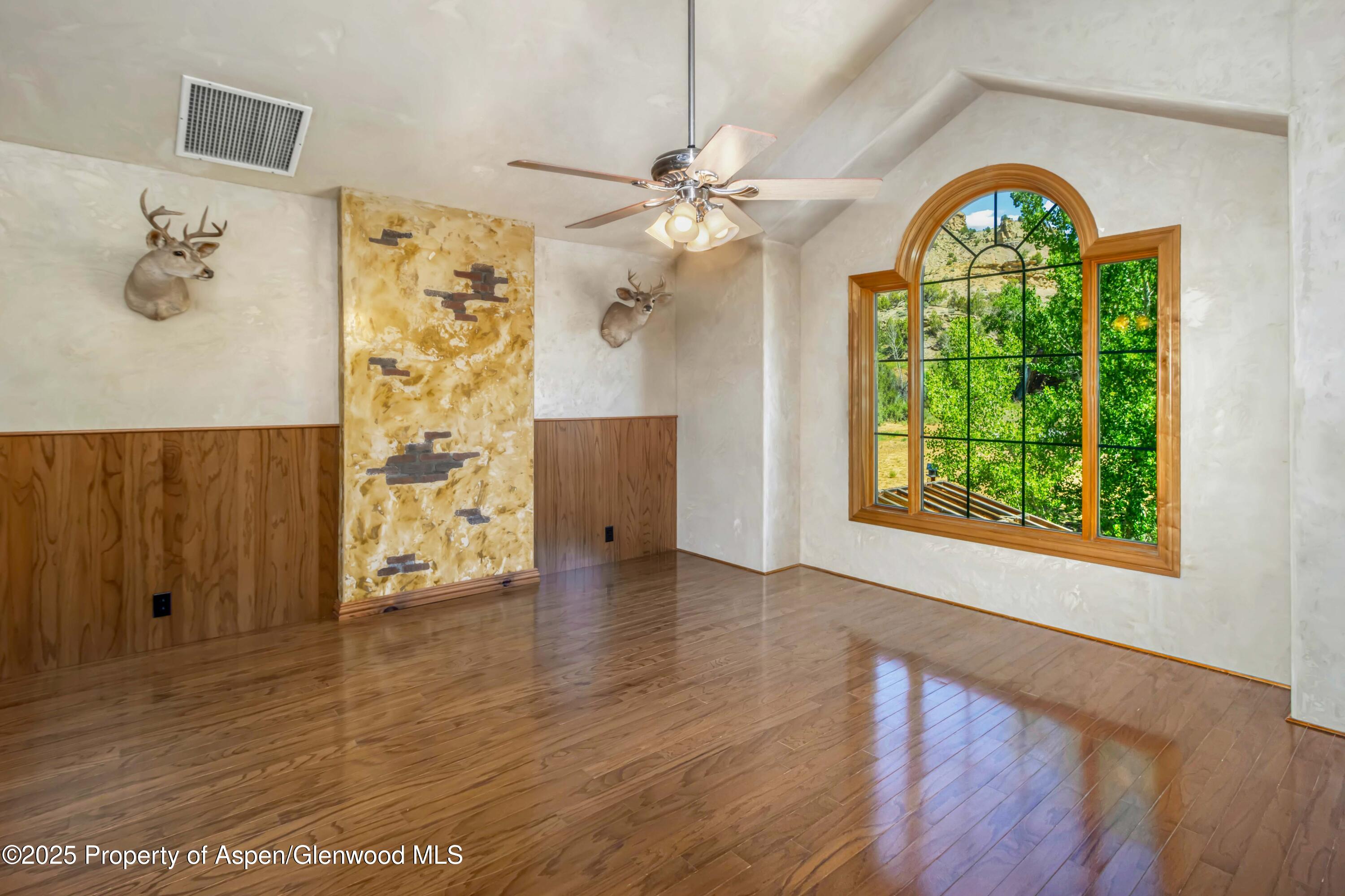 2687 Fairview Heights Court Rifle, CO 81650 - Photo 27 of 40 wooden floor in an empty room with a window