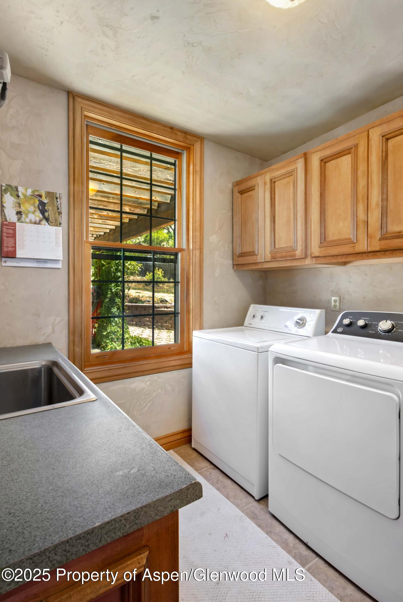 2687 Fairview Heights Court Rifle, CO 81650 - Photo 30 of 40 a view of washer and dryer sitting inside of a kitchen