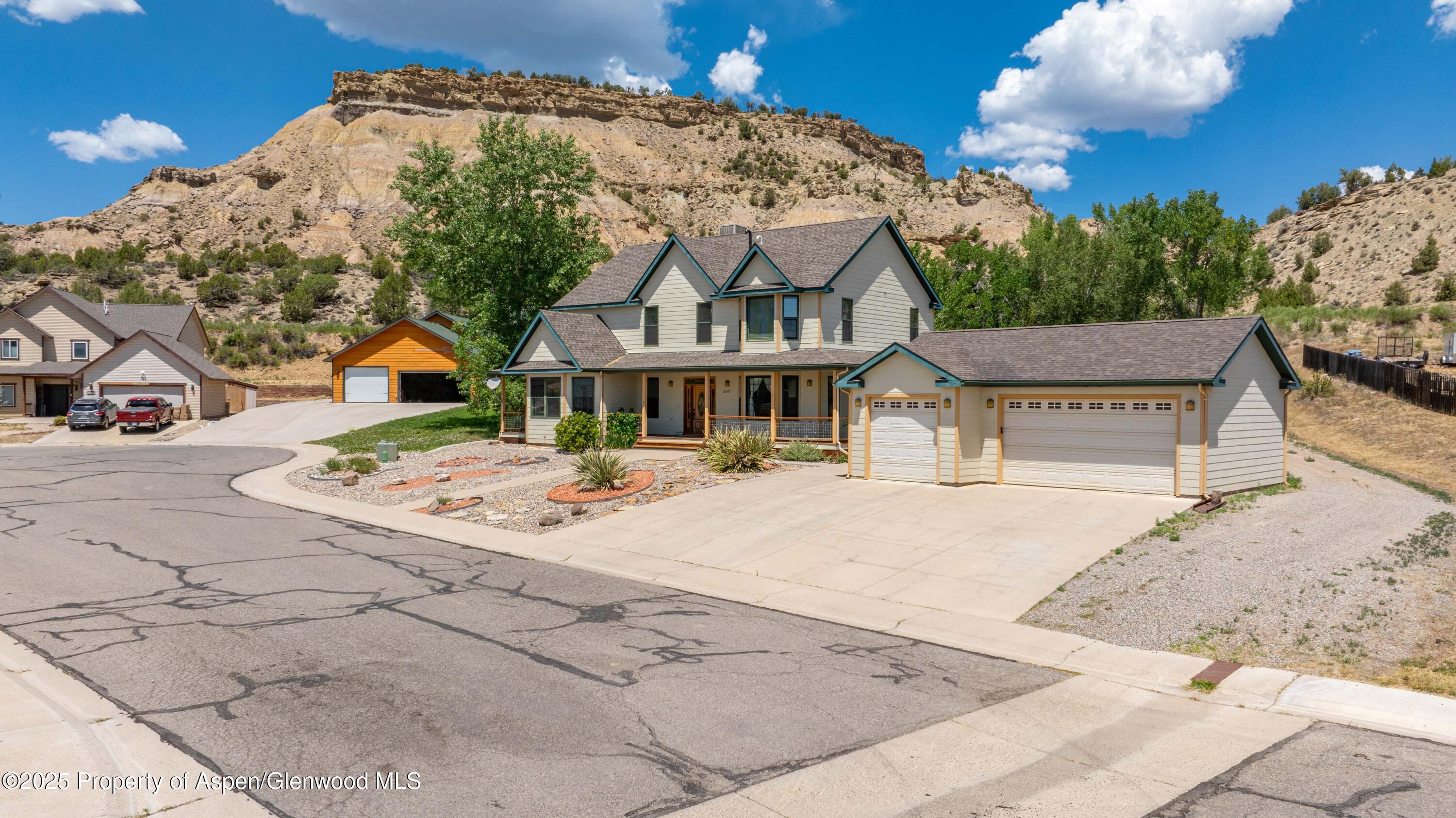 2687 Fairview Heights Court Rifle, CO 81650 - Photo 3 of 40 a front view of a house with a garden