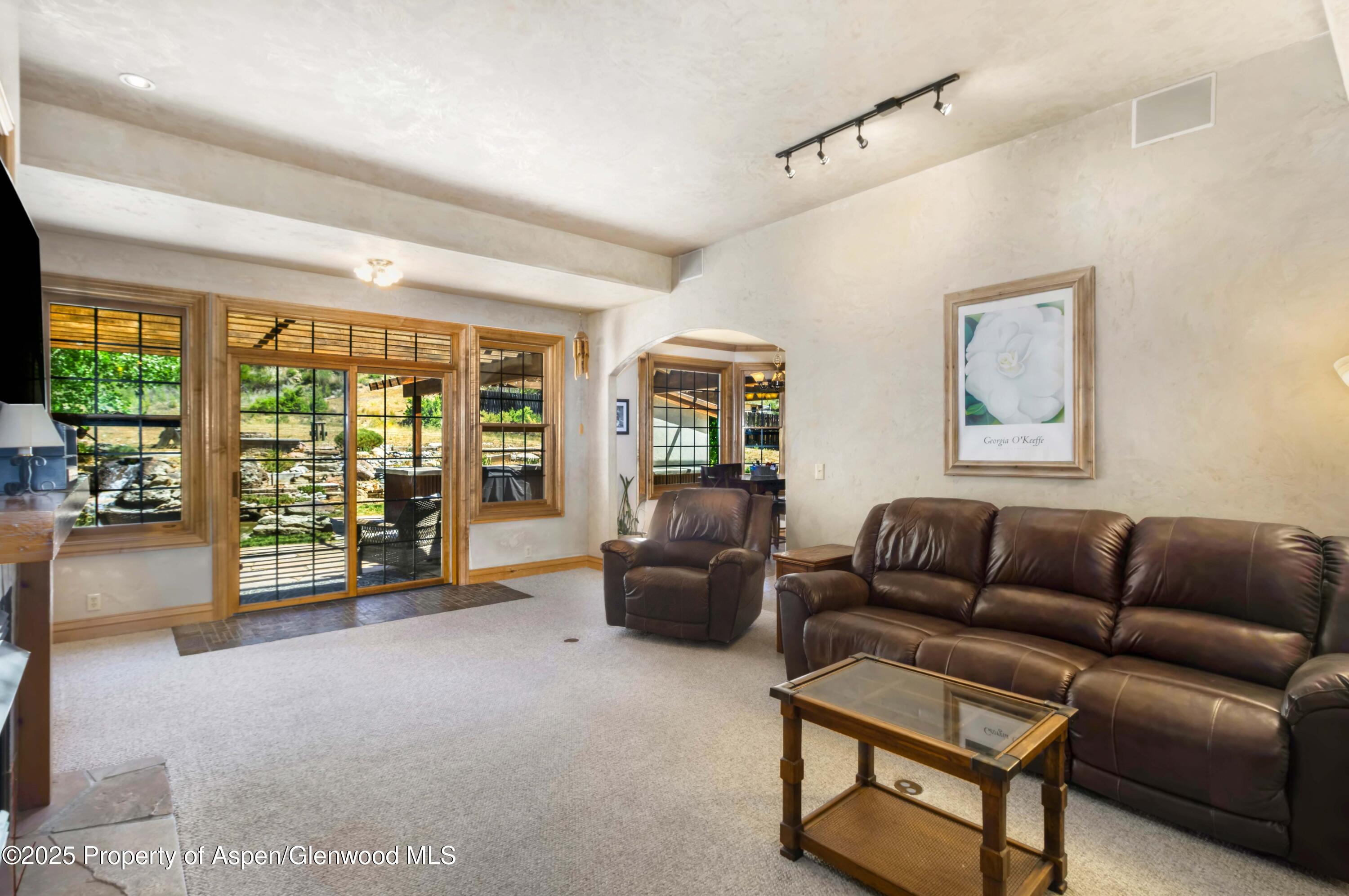 2687 Fairview Heights Court Rifle, CO 81650 - Photo 7 of 40 a living room with furniture and large windows